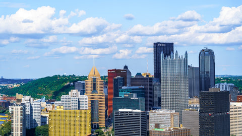 city buildings under blue sky during daytime