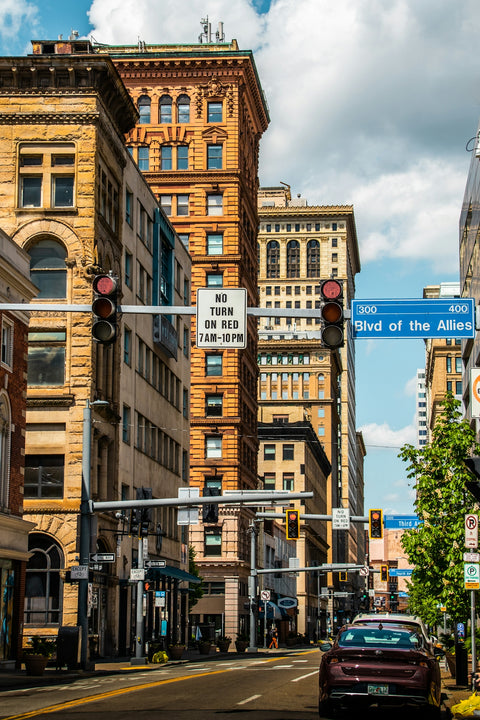 a street sign in front of a large building