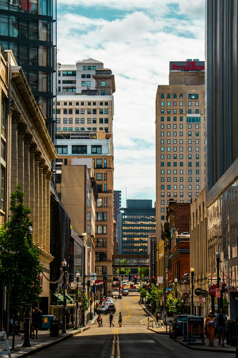 a city street with tall buildings
