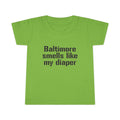 Green toddler T-shirt with 'Baltimore smells like my diaper' printed in black, a playful and cheeky kids clothing option.