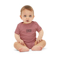 Baby wearing mauve pink 'Baltimore smells like my diaper' onesie, ideal for stylish and humorous baby outfits.