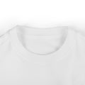Close-up of white infant T-shirt neckline, showcasing soft cotton fabric for baby clothing comfort.