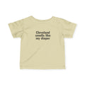 Beige Cleveland Smells Like My Diaper infant jersey t-shirt with bold black text, perfect for funny baby outfits.