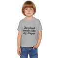 Toddler wearing gray Cleveland Smells Like My Diaper t-shirt, showcasing a playful design in soft cotton for children's casual outfits.