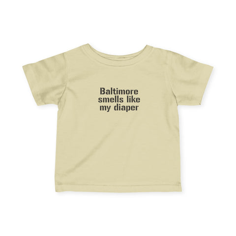 Beige infant T-shirt with 'Baltimore smells like my diaper' text, perfect for humorous baby apparel.