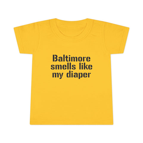 Bright yellow toddler T-shirt featuring the phrase 'Baltimore smells like my diaper' in black font, ideal for funny kids apparel.
