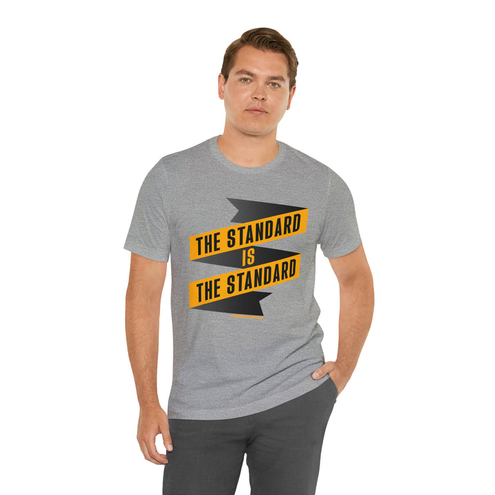 El Estándar  Es  El Estándar - The Standard is the Standard - Español Series - Banner - Short Sleeve Tee T-Shirt Printify   