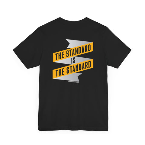 The Standard Is The Standard - Banner - DESIGN ON BACK - Short Sleeve Tee T-Shirt Printify   