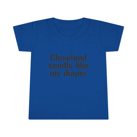 Blue toddler T-shirt with black print 'Cleveland smells like my diaper,' designed for humorous and casual kids clothing.