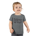 Toddler in dark gray T-shirt with 'Baltimore smells like my diaper' slogan, a cheeky and fun kids fashion item.