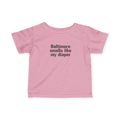 Pink infant jersey T-shirt with bold black 'Baltimore smells like my diaper' text for baby apparel.