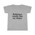Gray toddler T-shirt with bold black text reading 'Baltimore smells like my diaper', perfect for humorous kids clothes collections.