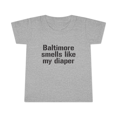 Gray toddler T-shirt with bold black text reading 'Baltimore smells like my diaper', perfect for humorous kids clothes collections.