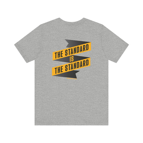 The Standard Is The Standard - Banner - DESIGN ON BACK - Short Sleeve Tee T-Shirt Printify   