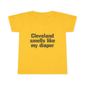 Bright yellow toddler T-shirt featuring the funny slogan 'Cleveland smells like my diaper' in bold black print, ideal for playful kids fashion.