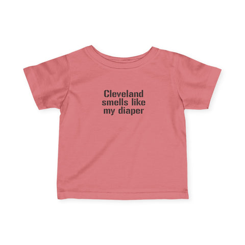 Coral pink Cleveland Smells Like My Diaper infant t-shirt with black text, humorous and soft baby clothing.